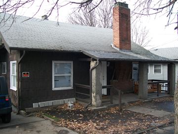Pullman apartment for rent - A house with a grey roof and a brick chimney.