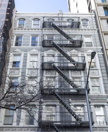New York apartment for rent - a fire escape on the side of a building