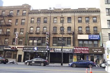 Brooklyn apartment for rent - A street view of a building with a law office on the top floor.