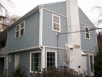 Pullman apartment for rent - the outside of a house with blue siding and white bricks