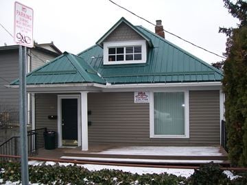 Pullman apartment for rent - A house with a green roof and a sign that says "No Parking".