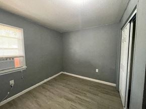 Kennewick apartment for rent - an empty room with gray walls and a window