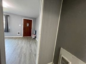 Kennewick apartment for rent - a living room with a wooden floor and a door
