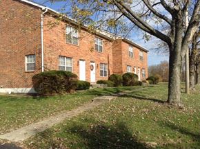 Pickerington apartment for rent - a brick building with a tree in front of it