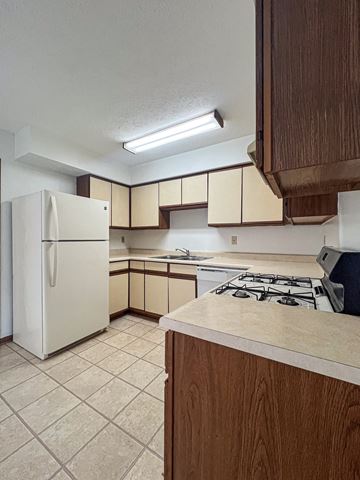 Pickerington apartment for rent - a kitchen with a stove and a refrigerator