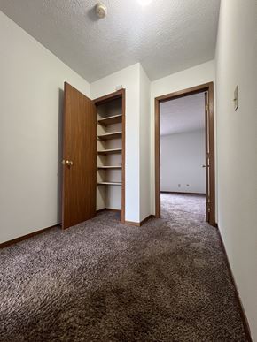 Pickerington apartment for rent - an empty bedroom with a closet and a door to a closet