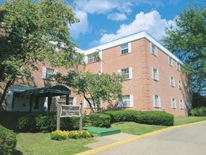 Columbus apartment for rent - a brick building with a sign in front of it
