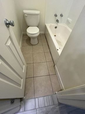 Jonesboro apartment for rent - a bathroom with a toilet and a bath tub