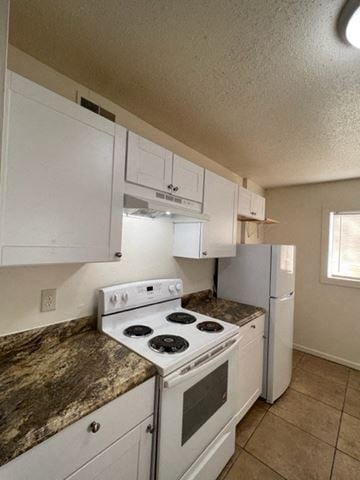 Jonesboro apartment for rent - a kitchen with white appliances and white cabinets