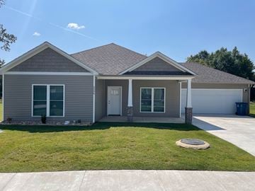 Benton house for rent - a gray house with a lawn and a driveway