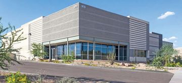 Phoenix apartment for rent - an office building with large glass windows and a street