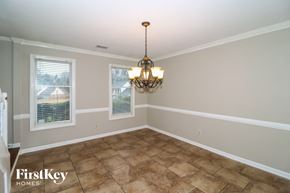 Memphis house for rent - a dining room with a chandelier and a window