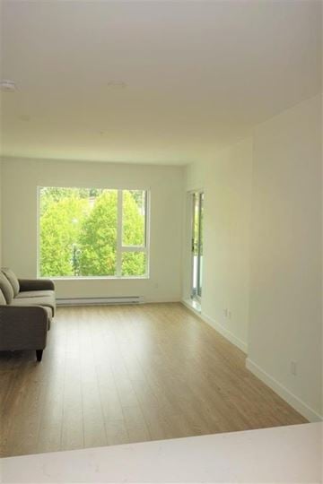 North Vancouver apartment for rent - A living room with a couch and a window.