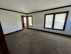 Lakewood apartment for rent - A room with carpeted floor and two windows.