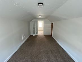 Lakewood apartment for rent - A room with carpeted floor and white walls.