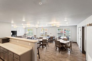 Winona apartment for rent - our dining room and living room with tables and chairs and a kitchen and dining area