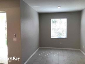 Lehigh Acres house for rent - an empty room in a house with a window