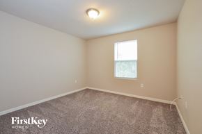 Palm Coast house for rent - the upstairs bedroom with carpet and a window