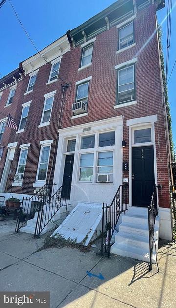 Philadelphia apartment for rent - a brick building with stairs in front of it