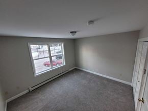 Lewiston apartment for rent - a bedroom with a large window and carpet