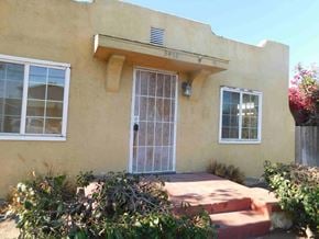 San Diego house for rent - the front of a house with a glass door and a porch