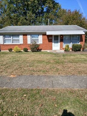Louisville house for rent - a house with a lawn in front of it