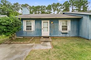 Jacksonville house for rent - A blue house with a white door and windows.