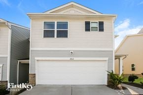 Concord house for rent - a white house with a white garage door