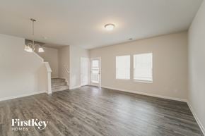 Concord house for rent - a spacious living room with white walls and wood floors