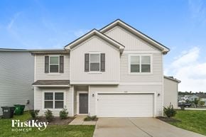 Charlotte house for rent - a white house with white siding and a driveway