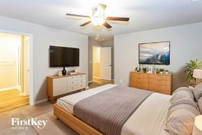 Concord house for rent - A bedroom with a bed, dresser, and tv.