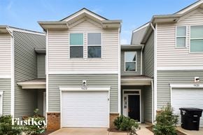 Concord house for rent - a white and gray house with a white garage door