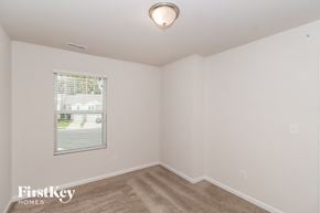 Concord house for rent - a bedroom with white walls and a window