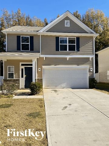 Charlotte house for rent - a tan house with a white garage door