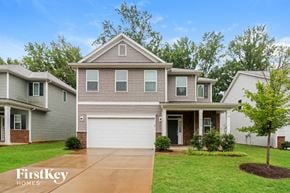 Charlotte house for rent - A house with a garage is shown in the image.