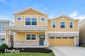 Lewisville house for rent - a yellow and with a yellow garage door