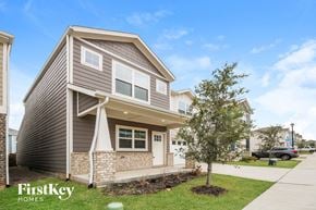 Lewisville house for rent - a house with a sidewalk and a tree in front of it