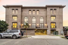 Los Angeles apartment for rent - the front of a building with a car parked in front