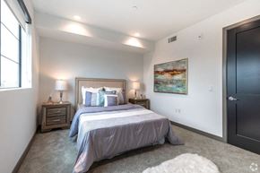 Los Angeles apartment for rent - a bedroom with a bed and a black door