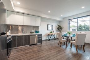 Los Angeles apartment for rent - a kitchen and dining room with a table and chairs