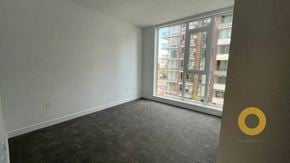 Richmond house for rent - an empty living room with a large window