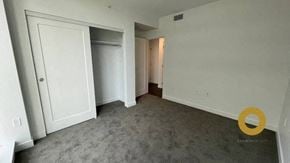 Richmond house for rent - a empty living room with white walls and a closet