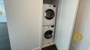 Richmond house for rent - a washing machine and dryer in a white door