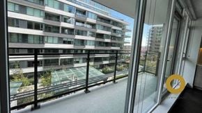 Richmond house for rent - a balcony with a view of a large apartment building