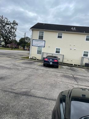 Pasadena apartment for rent - a car parked in a parking lot in front of a building