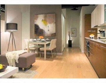 Vancouver apartment for rent - A modern living room with a dining table and chairs.