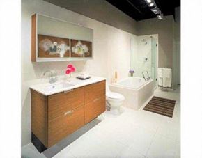 Vancouver apartment for rent - A modern bathroom with a white countertop and a brown cabinet.