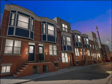 Philadelphia apartment for rent - a row of brick apartment buildings on a city street at night
