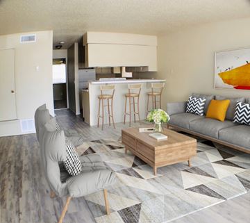 Amarillo apartment for rent - A living room with a grey couch and a grey chair.