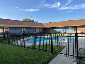 El Campo apartment for rent - A pool surrounded by a black fence with a sign that says to keep the pool closed at all times.